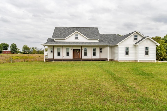 101 Lauren Grace Ct, Elsberry, MO 63343 - view of front of property featuring board and batten siding, a front lawn, roof with shingles, and a porch
