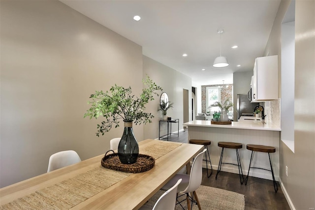 4211 Norfolk Ave, Saint Louis, MO 63110 - dining room featuring dark wood-type flooring, recessed lighting, and baseboards