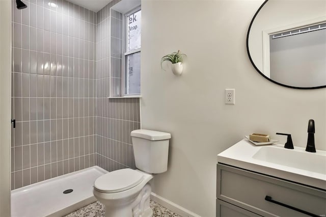 4211 Norfolk Ave, Saint Louis, MO 63110 - full bath with baseboards, toilet, vanity, and tiled shower