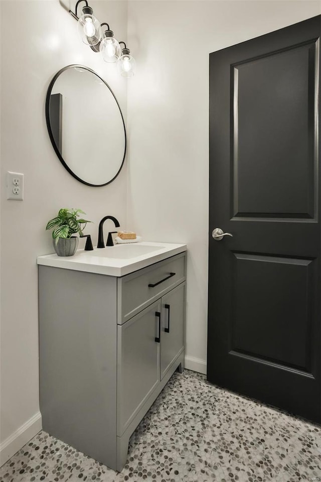 4211 Norfolk Ave, Saint Louis, MO 63110 - bathroom with baseboards and vanity