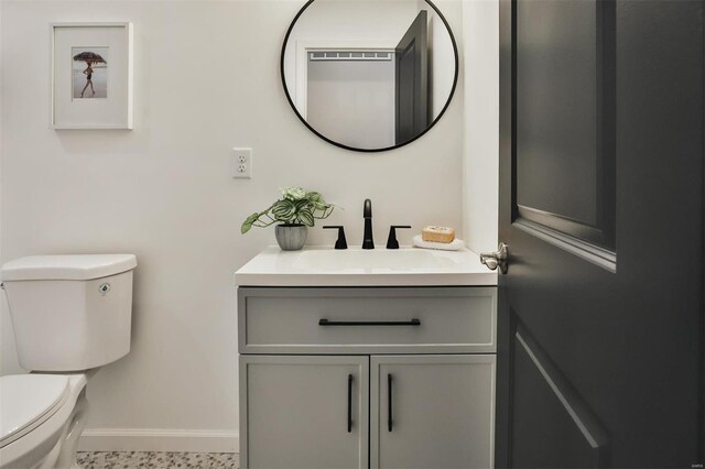 4211 Norfolk Ave, Saint Louis, MO 63110 - half bath with toilet, baseboards, and vanity