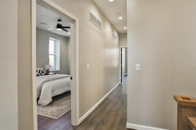 4211 Norfolk Ave, Saint Louis, MO 63110 - corridor featuring dark wood-type flooring, recessed lighting, and baseboards