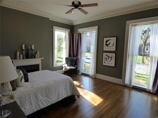 4969 Pershing Pl Unit 1, Saint Louis, MO 63108 - bedroom featuring wood finished floors, multiple windows, ornamental molding, and access to exterior