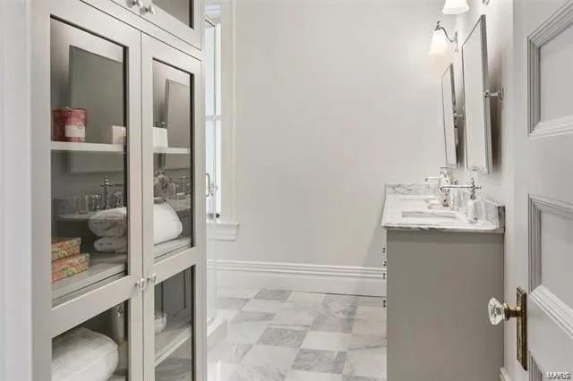 4969 Pershing Pl Unit 1, Saint Louis, MO 63108 - bathroom featuring vanity, tile patterned floors, and baseboards
