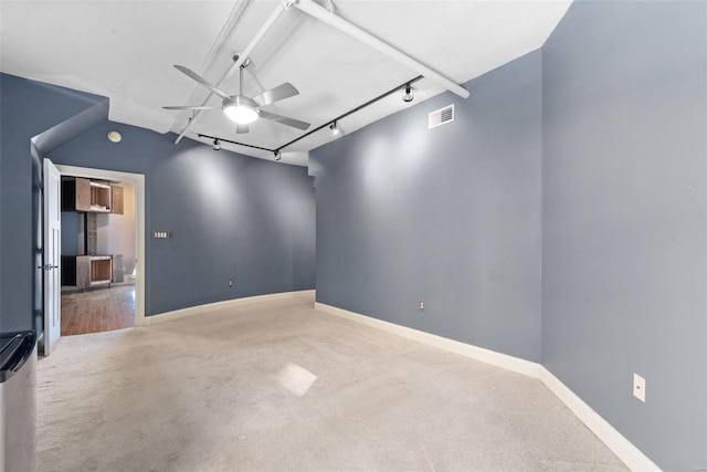 4901 Washington Blvd Unit 2C, Saint Louis, MO 63108 - carpeted empty room with ceiling fan, track lighting, and baseboards