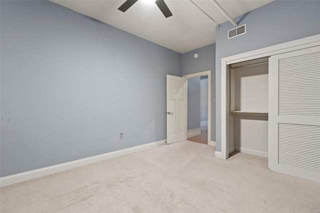 4901 Washington Blvd Unit 2C, Saint Louis, MO 63108 - unfurnished bedroom with carpet floors, a closet, baseboards, and a ceiling fan