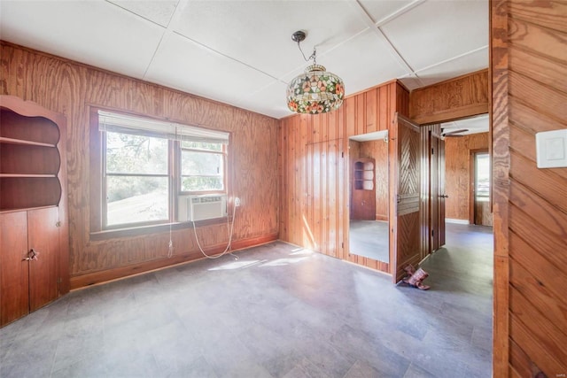 2251 County Road 6670, Salem, MO 65560 - spare room featuring wood walls, tile patterned floors, and cooling unit