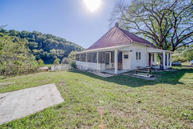 2251 County Road 6670, Salem, MO 65560 - rear view of property with a patio, a sunroom, metal roof, and a chimney