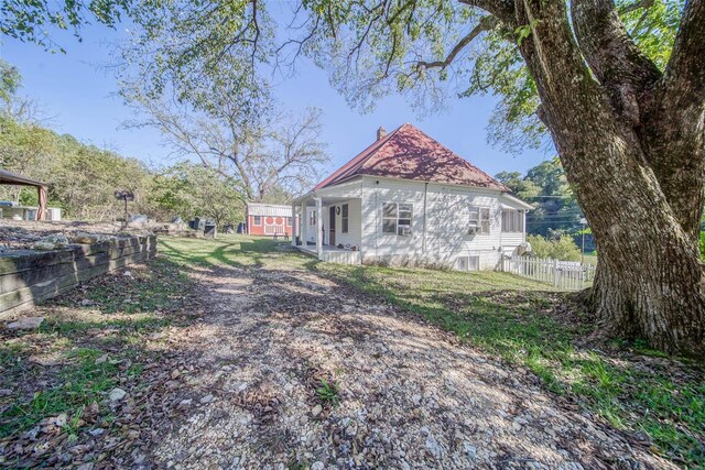 2251 County Road 6670, Salem, MO 65560 - view of side of home featuring fence and a chimney
