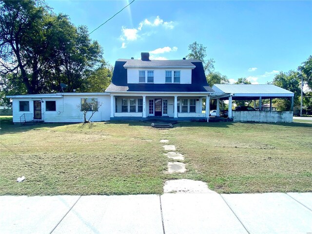 101 E Cedar St, Bertrand, MO 63823 - view of front of home featuring a front yard, covered porch, and a chimney