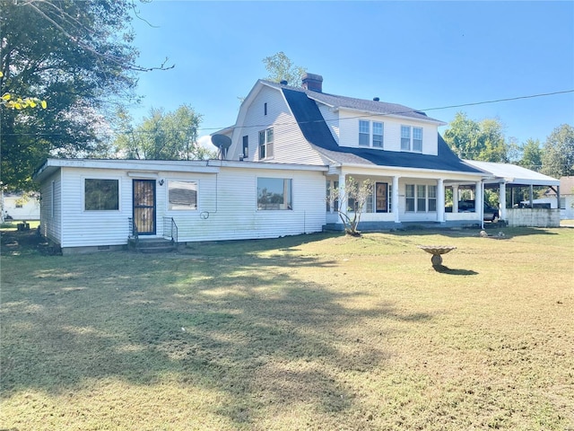 101 E Cedar St, Bertrand, MO 63823 - back of property featuring entry steps, a yard, a gambrel roof, and a chimney