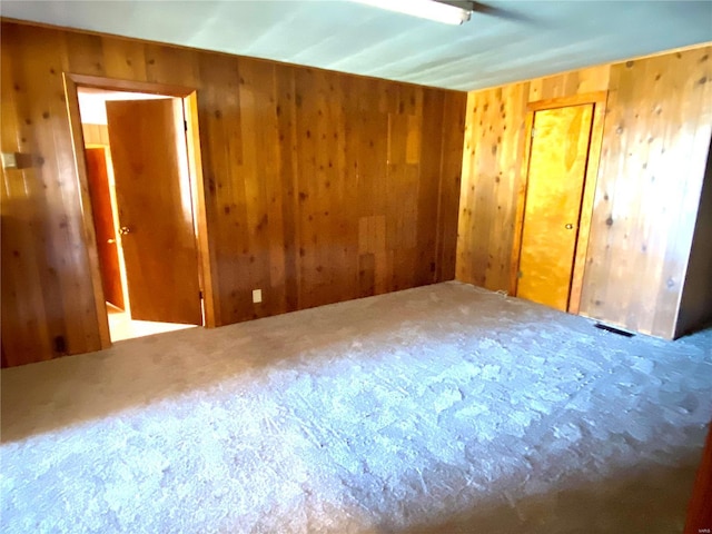 101 E Cedar St, Bertrand, MO 63823 - unfurnished room with carpet and wooden walls