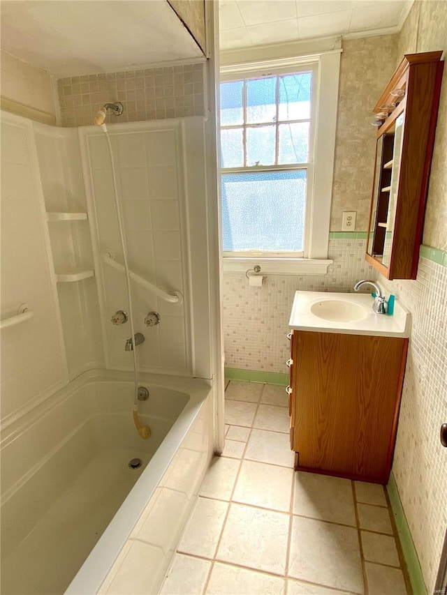 101 E Cedar St, Bertrand, MO 63823 - full bathroom with vanity, wallpapered walls, tile patterned floors, shower / tub combination, and baseboards