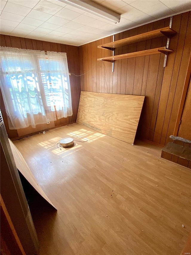 101 E Cedar St, Bertrand, MO 63823 - unfurnished room featuring wooden walls and light wood-type flooring