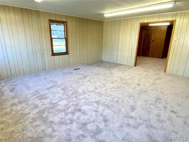 101 E Cedar St, Bertrand, MO 63823 - carpeted spare room with wooden walls