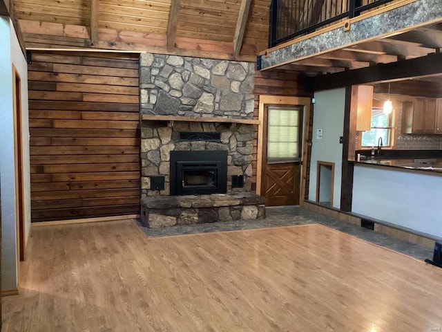 1102 County Road 5, Rockwood, IL 62280 - living room featuring wood finished floors, wooden walls, wooden ceiling, and a fireplace