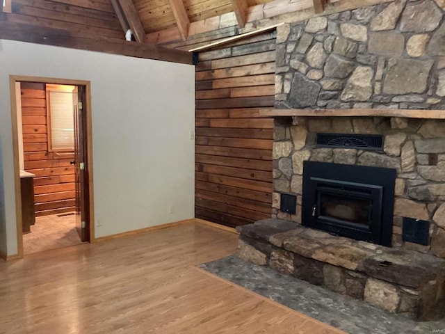 1102 County Road 5, Rockwood, IL 62280 - living area featuring wooden ceiling, a stone fireplace, wood finished floors, baseboards, and wood walls