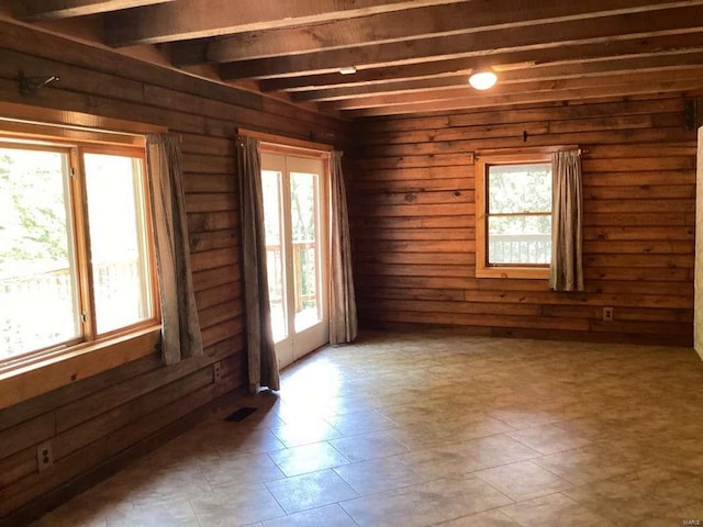 1102 County Road 5, Rockwood, IL 62280 - empty room featuring plenty of natural light, beam ceiling, and wood walls