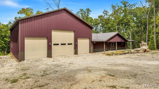 18305 Joerling Ln, Marthasville, MO 63357 - detached garage with a porch