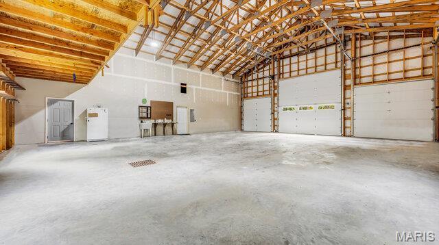 18305 Joerling Ln, Marthasville, MO 63357 - garage featuring freestanding refrigerator