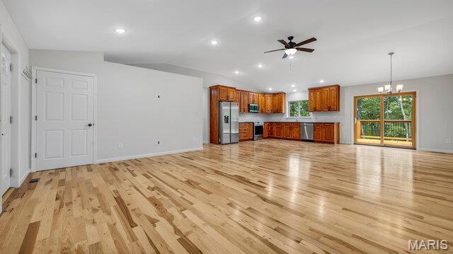 18305 Joerling Ln, Marthasville, MO 63357 - unfurnished living room with a ceiling fan, a chandelier, light wood finished floors, recessed lighting, and baseboards