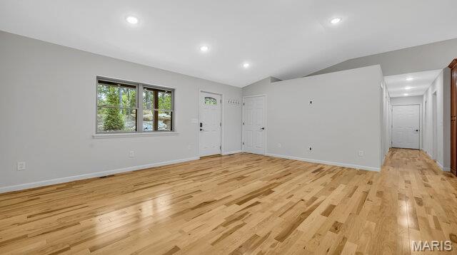 18305 Joerling Ln, Marthasville, MO 63357 - entryway with light wood-style floors, lofted ceiling, baseboards, and recessed lighting