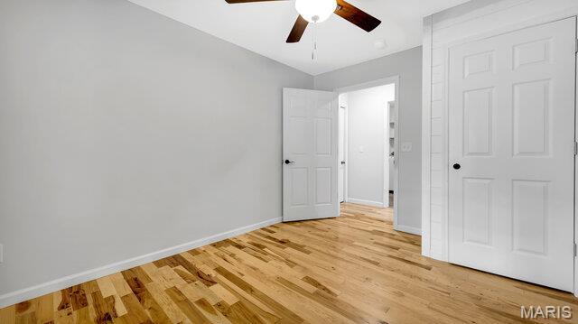 18305 Joerling Ln, Marthasville, MO 63357 - unfurnished bedroom with baseboards, light wood finished floors, and a ceiling fan