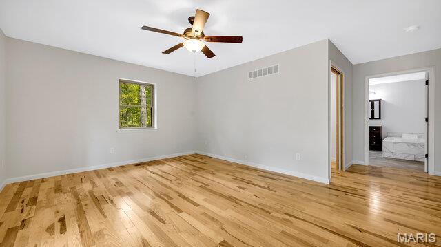 18305 Joerling Ln, Marthasville, MO 63357 - empty room featuring wood finished floors, ceiling fan, and baseboards