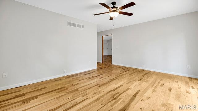 18305 Joerling Ln, Marthasville, MO 63357 - unfurnished room featuring a ceiling fan, light wood-type flooring, and baseboards