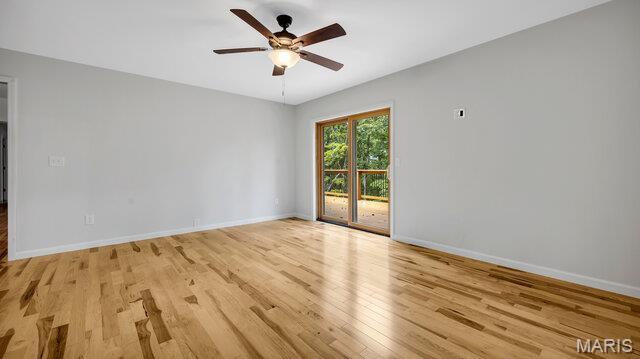 18305 Joerling Ln, Marthasville, MO 63357 - empty room with light wood-type flooring, a ceiling fan, and baseboards