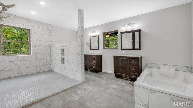 18305 Joerling Ln, Marthasville, MO 63357 - full bathroom with two vanities, a garden tub, and recessed lighting