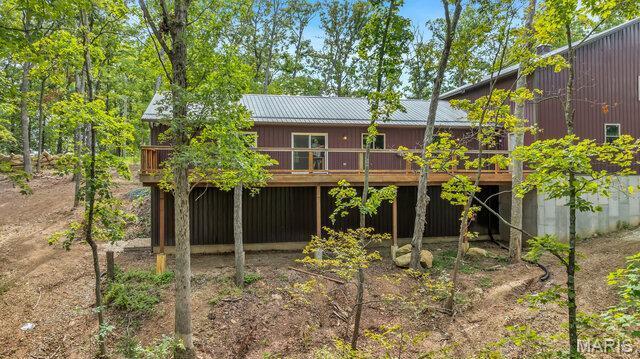 18305 Joerling Ln, Marthasville, MO 63357 - back of property featuring a wooden deck and metal roof