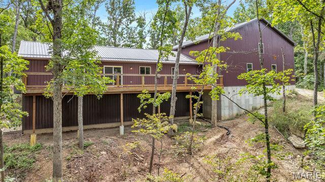 18305 Joerling Ln, Marthasville, MO 63357 - rear view of property featuring a deck and metal roof