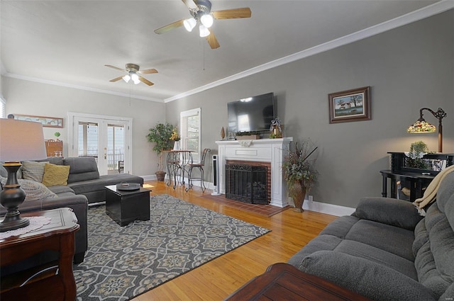 401 Elm St, Washington, MO 63090 - living area featuring ceiling fan, baseboards, wood finished floors, french doors, and crown molding