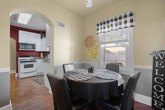 401 Elm St, Washington, MO 63090 - dining space featuring arched walkways, plenty of natural light, and baseboards