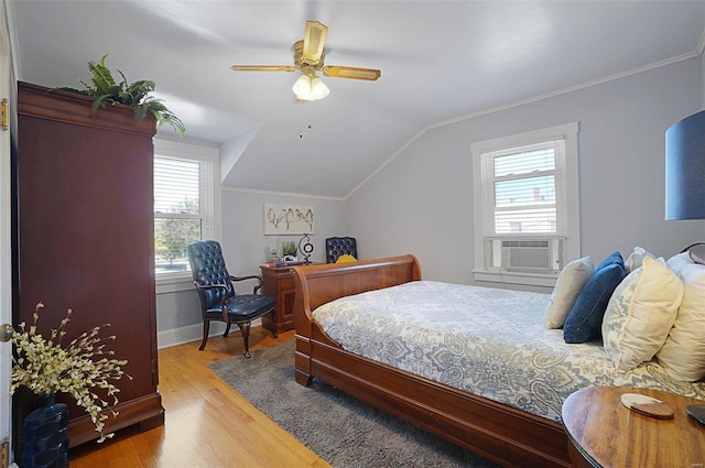 401 Elm St, Washington, MO 63090 - bedroom featuring wood finished floors, lofted ceiling, baseboards, ceiling fan, and cooling unit