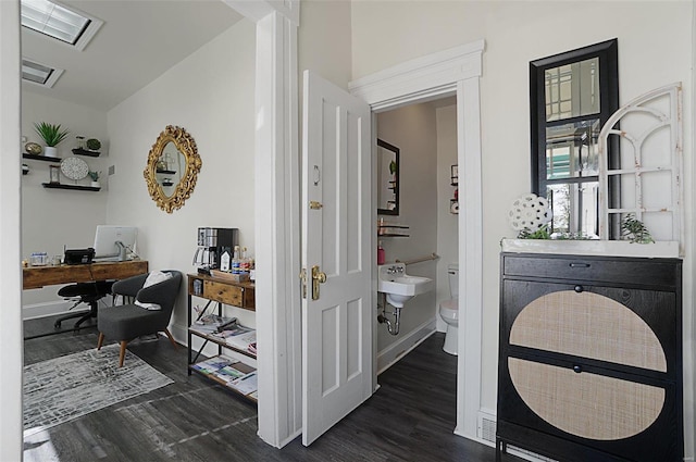 401 Elm St, Washington, MO 63090 - bathroom featuring wood finished floors, toilet, and baseboards
