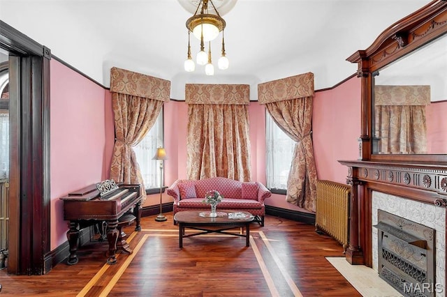 2712 S Compton Ave, Saint Louis, MO 63118 - living area featuring wood finished floors and a fireplace with flush hearth
