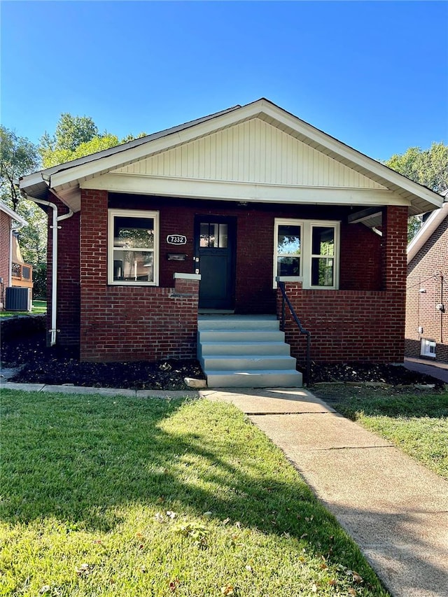 7332 Bruno Ave, Saint Louis, MO 63117 - bungalow featuring a porch, a front yard, brick siding, and central AC