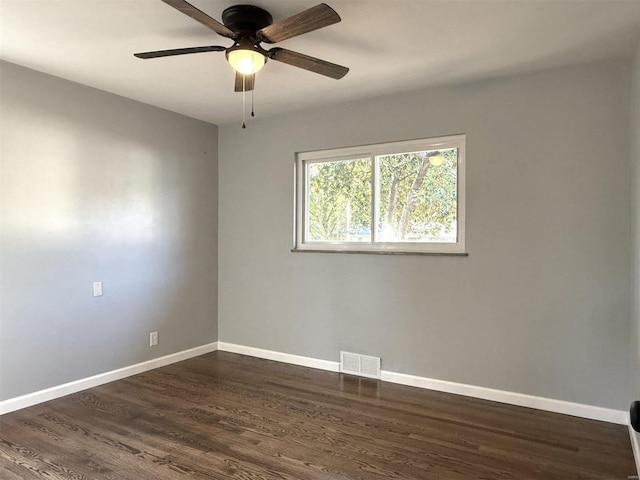 7459 Ahern Ave, Saint Louis, MO 63130 - spare room with baseboards, dark wood-style floors, and ceiling fan