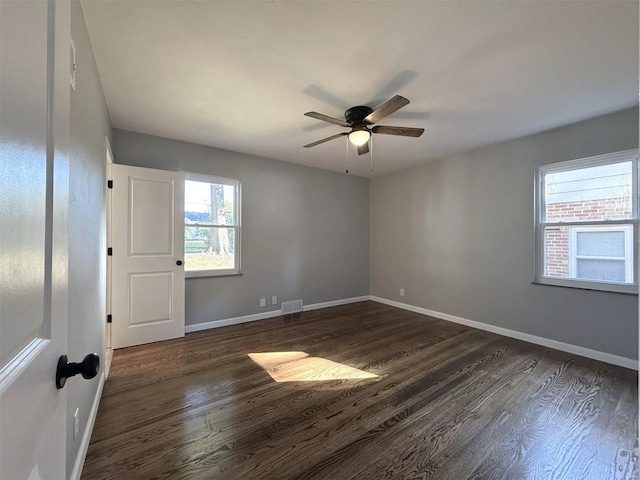 7459 Ahern Ave, Saint Louis, MO 63130 - unfurnished room featuring dark wood-style floors, baseboards, and a ceiling fan