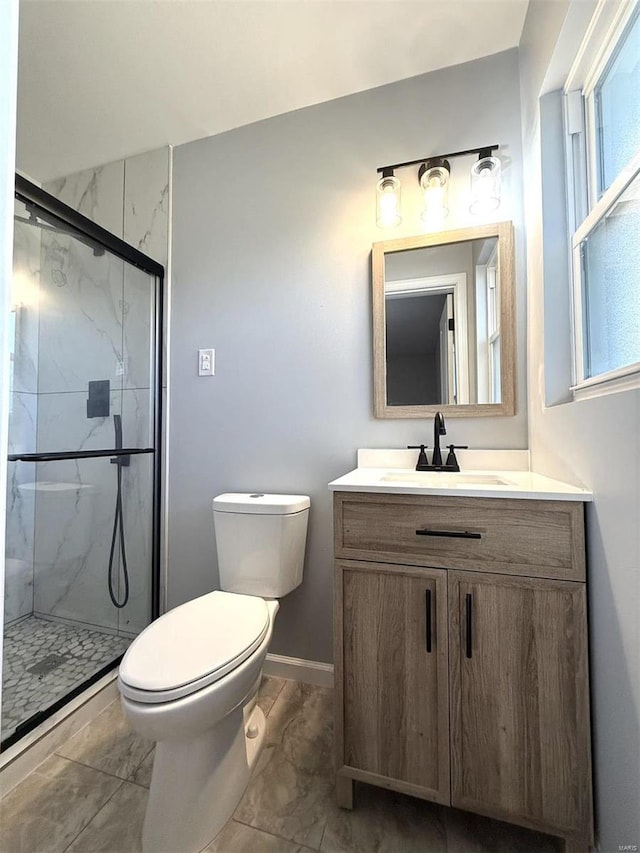 7459 Ahern Ave, Saint Louis, MO 63130 - full bath with marble finish floors, a marble finish shower, toilet, vanity, and baseboards