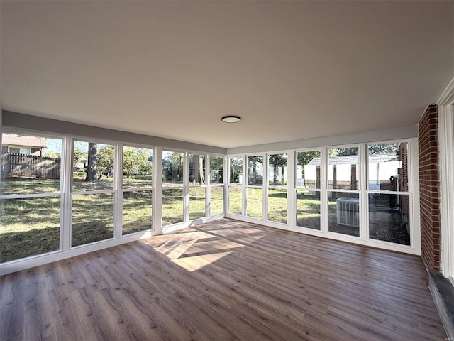 7459 Ahern Ave, Saint Louis, MO 63130 - unfurnished sunroom with wood finished floors and a deck