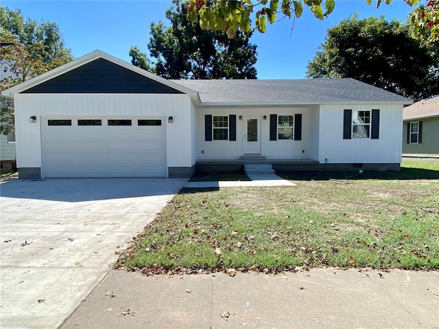 317 E Cypress St, Charleston, MO 63834 - ranch-style home featuring an attached garage, a front lawn, driveway, and crawl space