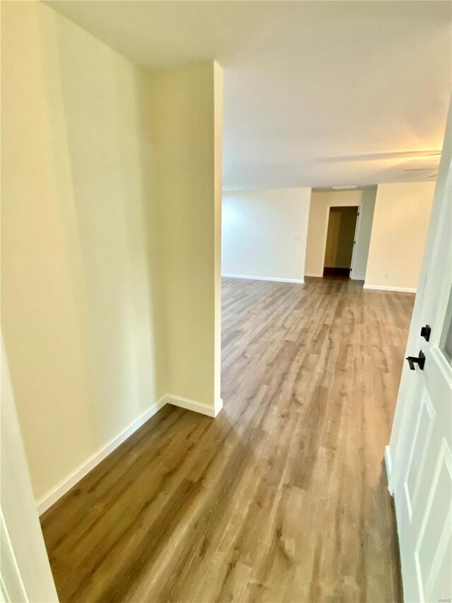 317 E Cypress St, Charleston, MO 63834 - unfurnished room featuring wood finished floors and baseboards