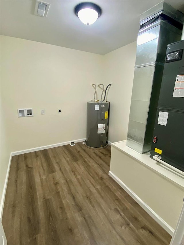 317 E Cypress St, Charleston, MO 63834 - utility room with water heater and heating unit