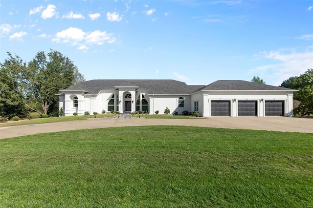 237 Kensington Ln, Cape Girardeau, MO 63701 - view of front of property featuring driveway, a front lawn, an attached garage, and stucco siding