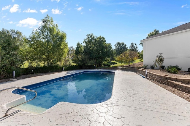 237 Kensington Ln, Cape Girardeau, MO 63701 - swimming pool featuring a patio area and view of wooded area