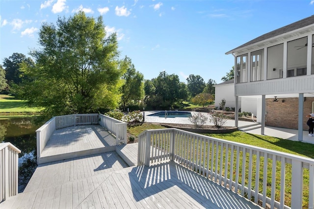 237 Kensington Ln, Cape Girardeau, MO 63701 - wooden deck with an outdoor pool, a patio area, and a lawn