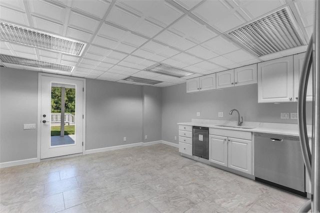 237 Kensington Ln, Cape Girardeau, MO 63701 - kitchen with stainless steel appliances, light countertops, a sink, baseboards, and extractor fan